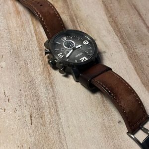 Fossil watch with adjustable leather band.